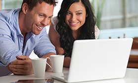 Couple looking at computer